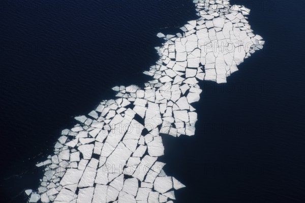 Aerial view of melting icepack in the East Greenland, Greenland (Kalaallit Nunaat), Arctic Ocean, climate change, global warming, geographically part of North America, politically part of the Kingdom of Denmark