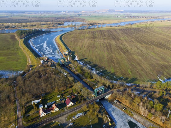 Lock surrounded by fields and a river curve, with an adjacent village, aerial view, Niegripp lock, Niegripper connection channel, connection between Elbe and Elbe-Havel Canal, Jerichower Land, Saxony-Anhalt, Germany