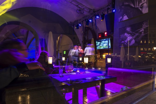 View of a karaoke bar at night, Krakow, Poland