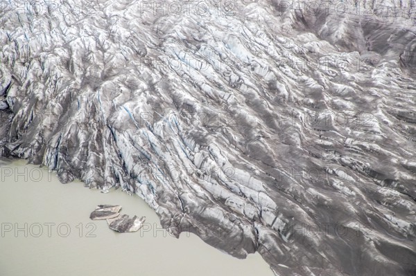 Aerial view of Greenland ice sheet and sea, Arctic landscape, frozen wilderness, glaciers and snow-covered terrain, Climate change, Global warming, Greenland, North America