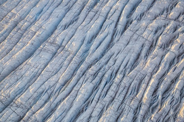 Aerial view of Ice sheet in Greenland, Arctic landscape, frozen wilderness, glaciers and snow-covered terrain, Climate change, Global warming, Greenland, North America