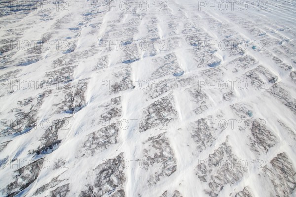 Aerial view of Ice sheet in Greenland, Arctic landscape, frozen wilderness, glaciers and snow-covered terrain, Climate change, Global warming, Greenland, North America