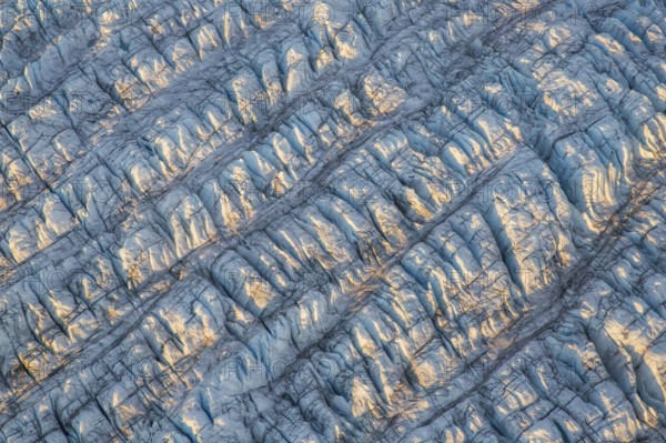 Aerial view of Ice sheet in Greenland, Arctic landscape, frozen wilderness, glaciers and snow-covered terrain, Climate change, Global warming, Greenland, North America