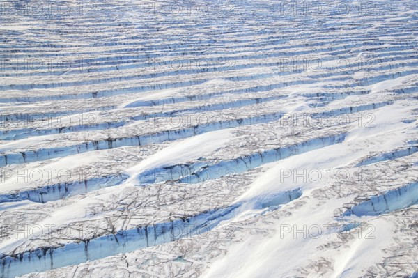 Aerial view of Ice sheet in Greenland, Arctic landscape, frozen wilderness, glaciers and snow-covered terrain, Climate change, Global warming, Greenland, North America