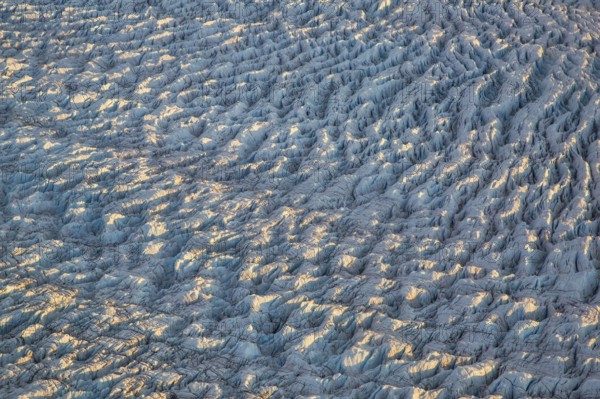 Aerial view of Ice sheet in Greenland, Arctic landscape, frozen wilderness, glaciers and snow-covered terrain, Climate change, Global warming, Greenland, North America