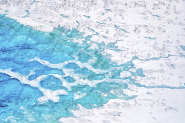 Aerial view of surface lakes (glacial/proglacial lakes), climate change, global warming, Arctic landscape with glaciers and snow-covered terrain, frozen wilderness, climate change, global warming, Greenland, geographically in North America, politically part of the Kingdom of Denmark