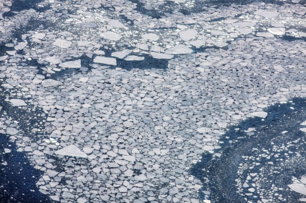 Aerial view of melting icepack in the East Greenland, Greenland (Kalaallit Nunaat), Arctic Ocean, climate change, global warming, geographically part of North America, politically part of the Kingdom of Denmark