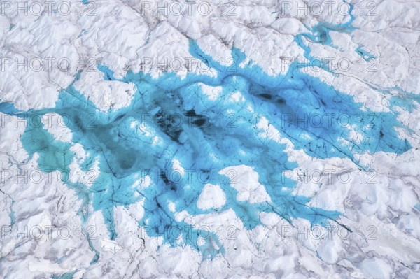 Aerial view of meltwater on the Greenland ice sheet, Arctic landscape, frozen wilderness, glaciers and snow-covered terrain, Climate change, Global warming, Greenland, North America