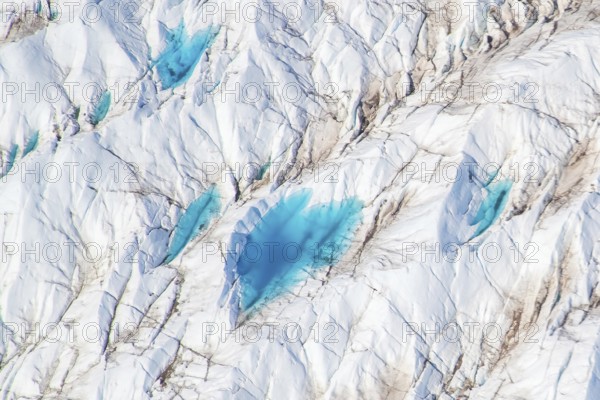 Aerial view of meltwater on the Greenland ice sheet, Arctic landscape, frozen wilderness, glaciers and snow-covered terrain, Climate change, Global warming, Greenland, North America