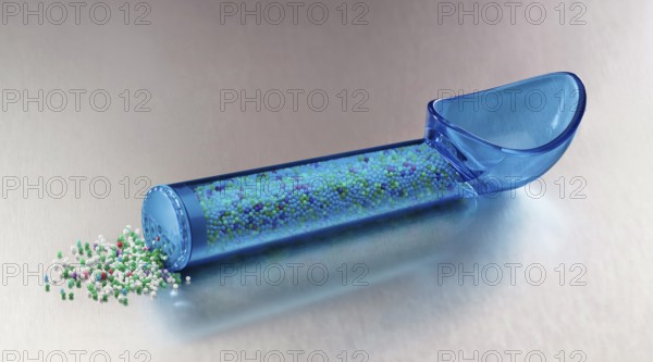 Blue, transparent ice cream scoop filled with coloured sugar sprinkles