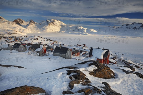 Sunrise at Tasiilaq (Angmagsalik in Inuit) a small village located on Ammassalik Island in the Irminger Sea, within the Sermersooq municipality, eastern Greenland, North America