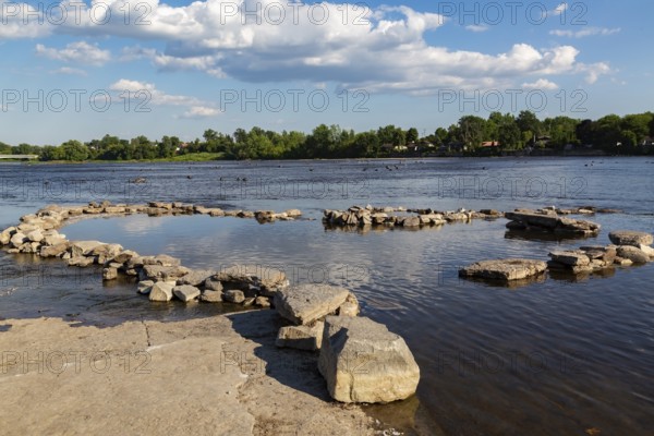 Enclosure built with rocks and stones in Des Mill-Iles RIver to contain fish when the water level is low in summer, Old Terrebonne, Quebec, Canada