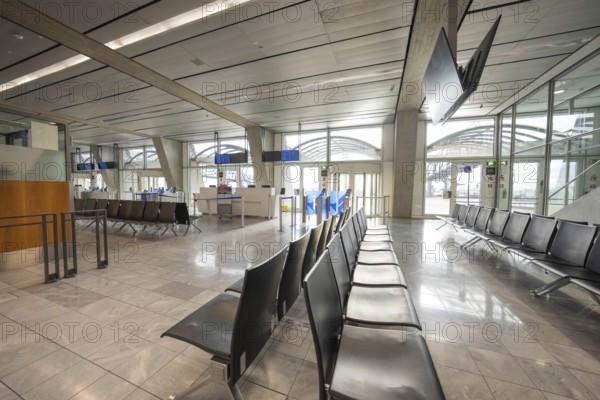 Modern, empty waiting area at the airport with elegant seats and large windows, Stuttgart Airport, Germany