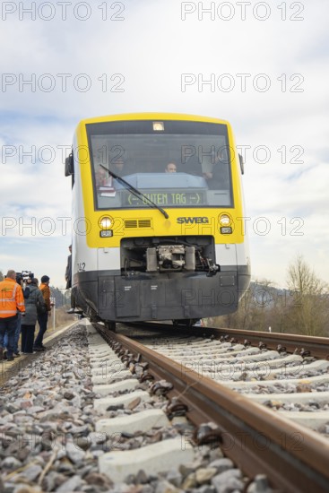 Front view of a train on rails with surrounding people and photographers, acceptance of the Hermann Hessebahn, Calw, Germany