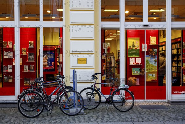 Bicycles parked in front of the Weiland bookstore at the fish market in the Hanseatic City of Greifswald, Mecklenburg-Western Pomerania, Germany, for editorial use only