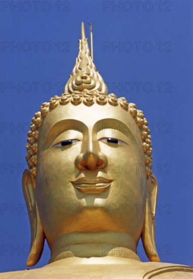 Portrait of the seated golden Buddha in Wat Phra Yai (Big Buddha Temple) at Hat Bangrak. The picture was taken in front of the renovation and shows the Buddha without the Buddhist wheel. Buddha, Buddhism, Religion, Koh Samui, Thailand, Southeast Asia