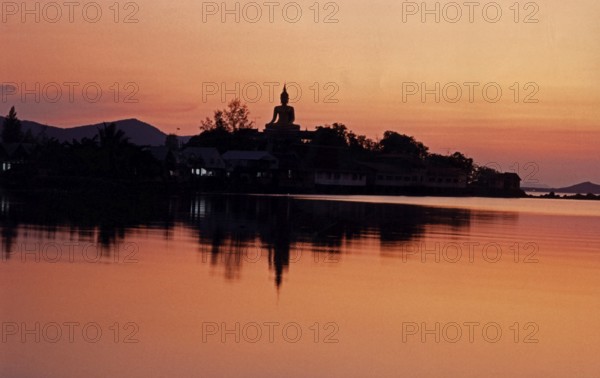 The big Buddha in Wat Phra Yai (Big Buddha Temple) at Hat Bangrak. The picture was taken in front of the renovation and shows the Buddha without the Buddhist wheel. Sunset. Buddhism, Religion, Koh Samui, Thailand, Southeast Asia