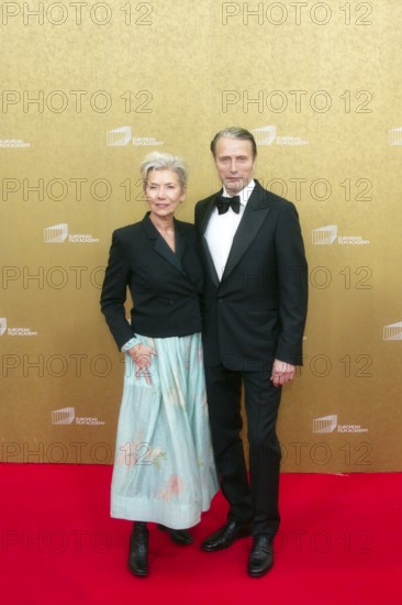 Mads Mikkelsen with woman Hanne Jacobsen, EUROPEAN FILM AWARDS Berlin 2026, photo call at the House of World Cultures, Berlin, 17.01.2026
