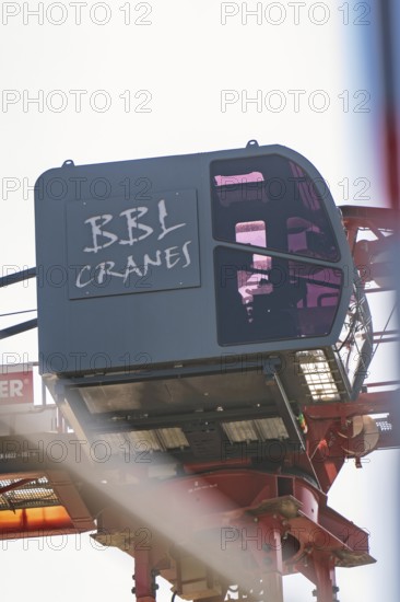 Close-up of a crane operator cabin with lettering in the construction zone, carpentry, new building, Stuttgart, Germany