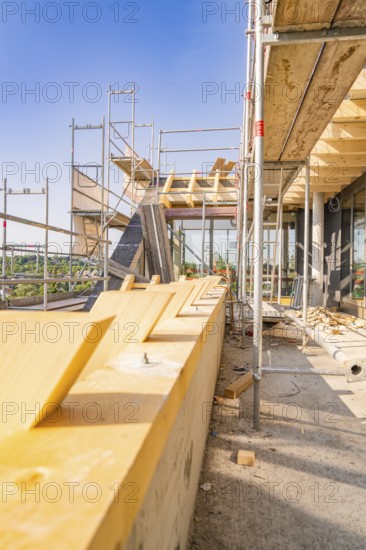 View of scaffolding with wooden panels under a clear sky, carpentry, new building, Stuttgart, Germany