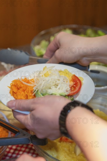 A plate of fresh salads and vegetables is served
