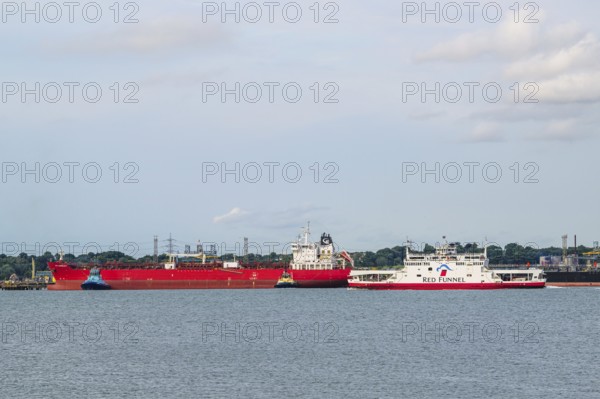 Red Funnel Ferry over refinery Esso Oil Terminal, Southampton, Hampshire, England, United Kingdom
