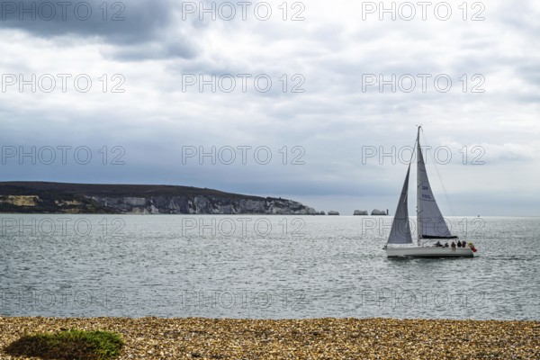 Yacht over Hurst Spit, Milford on Sea, Lymington, Hampshire, UK