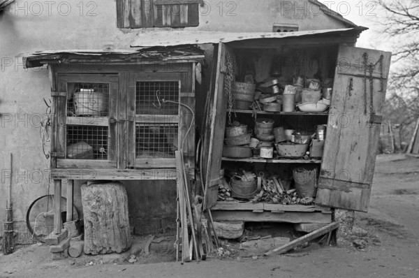 Collected utensils in a former rabbit stable, on a former Franconian farm, black and white, Bavaria, Germany