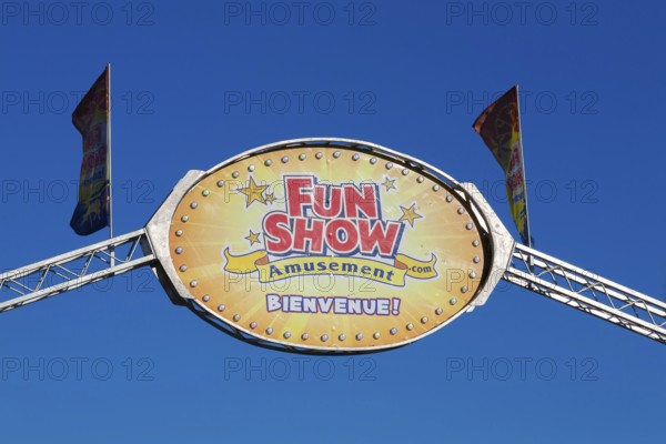 Close-up of Fun Show traveling amusement ride park banner with French word bienvenue spelled out in bold white letters, Old Port of Montreal, Quebec, Canada