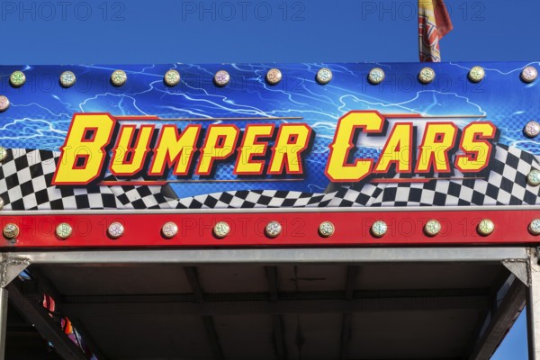 Close-up of Bumper Cars amusement ride banner at Fun Show traveling amusement ride park, Old Port of Montreal, Quebec, Canada