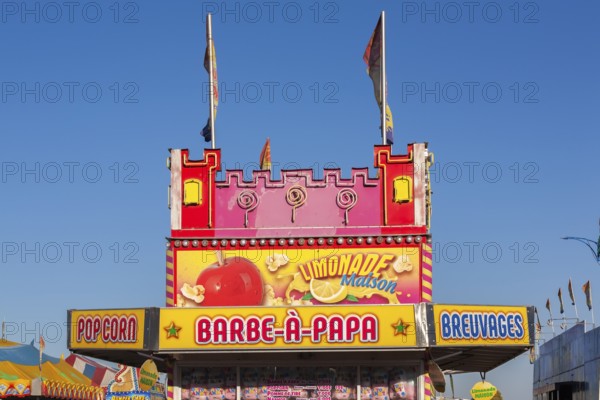 Barbe a Papa cotton candy, popcorn and beverages kiosk with French words at Fun Show traveling amusement ride park, Old Port of Montreal, Quebec, Canada