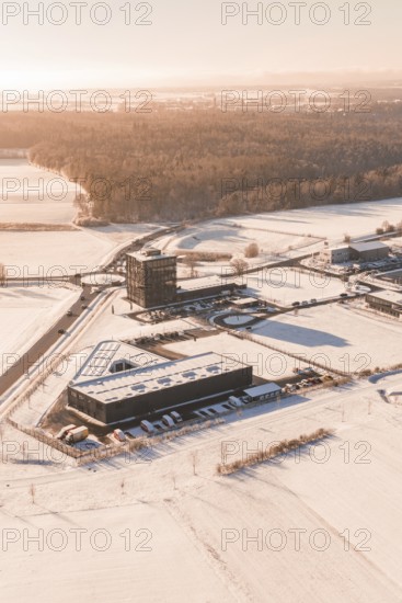 Snow-covered industrial area surrounded by extensive fields in wintry weather, Nagold, Calw district, Black Forest, Germany