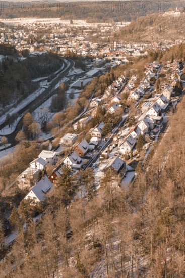 Snowy houses in a row along a hill with a wintry atmosphere, Nagold, Calw district, Black Forest, Germany