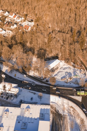 Snowy road junction on the edge of a forest with adjacent buildings, Nagold, Calw district, Black Forest, Germany