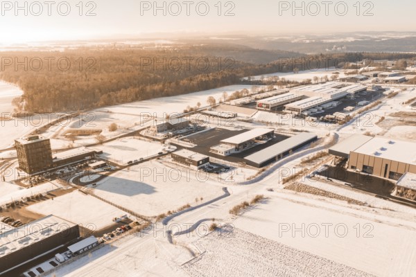 Snow-covered industrial area with adjacent forest and a clear view of the surrounding area, Nagold, Calw district, Black Forest, Germany