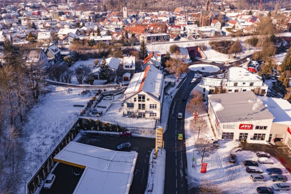 Snowy town with modern architecture, surrounding cars and roads, Nagold, Calw district, Black Forest, Germany