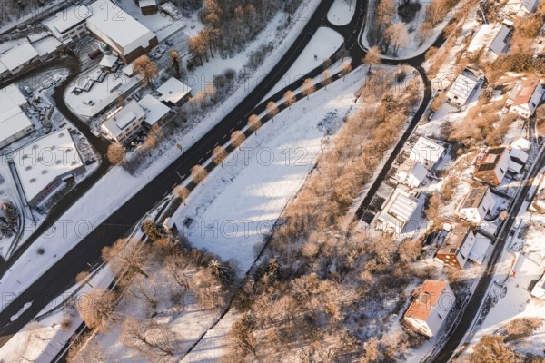 Bird's eye view of a snowy area with roads and ridges of houses, Nagold, Calw district, Black Forest, Germany