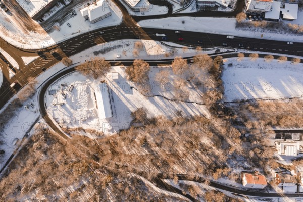 Aerial view of snowy landscape with roads, forests and buildings, Nagold, Calw district, Black Forest, Germany