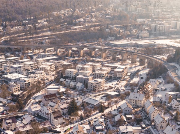 Snowy town with an impressive viaduct in a hilly landscape, Nagold, Calw district, Black Forest, Germany