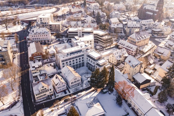 Snowy town with many houses and roads in the winter sun, Nagold, Calw district, Black Forest, Germany