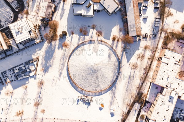 Aerial view of a snowy area surrounded by buildings, Celtic Tomb, Nagold, Calw district, Black Forest, Germany