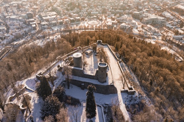 Panoramic view of a snowy castle with city in the background, surrounded by trees, Nagold, Calw district, Black Forest, Germany