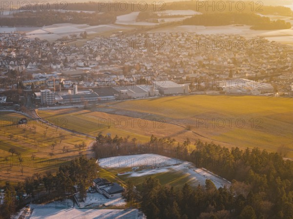 Panorama of city and landscape in evening light, with fields and forests in a winter setting, Althengstett, Calw district, Germany