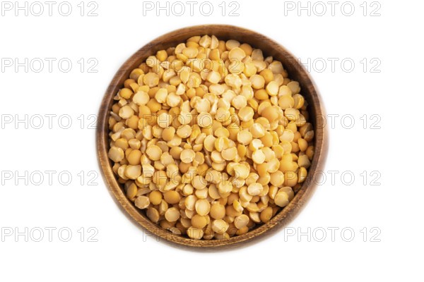 Split Pea raw in wooden bowl isolated on white background. Diet, healthy eating concept. top view, flat lay, close up, minimalism