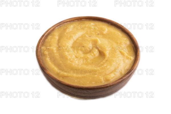 Pea cream soup, Puree, porridge in wooden bowl isolated on white background. Diet, healthy eating concept. side view, close up, minimalism