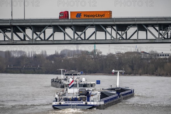 Cargo ships, Krefeld-Uerdinger bridge across the Rhine, near Krefeld-Uerdingen, North Rhine-Westphalia, Germany