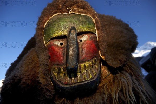 Portrait of traditional hand-carved wooden mask from the Loetschental Carnival, representing folkloric characters, spirits, and demons, Loetschental village, Valais Canton, Switzerland