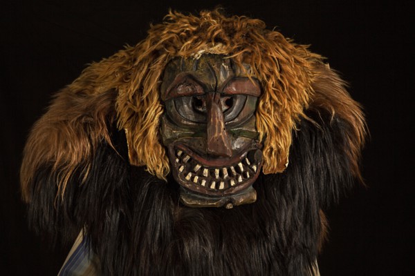 Portrait of traditional hand-carved wooden mask from the Loetschental Carnival, representing folkloric characters, spirits, and demons, Loetschental village, Valais Canton, Switzerland
