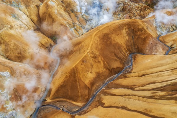Aerial view of the misty geothermal landscapes of Hveradalir, located in the active Kerlingarfjöll volcanic system, along F35 Kjölur (Kjalvegur) route, Central Highlands, Iceland