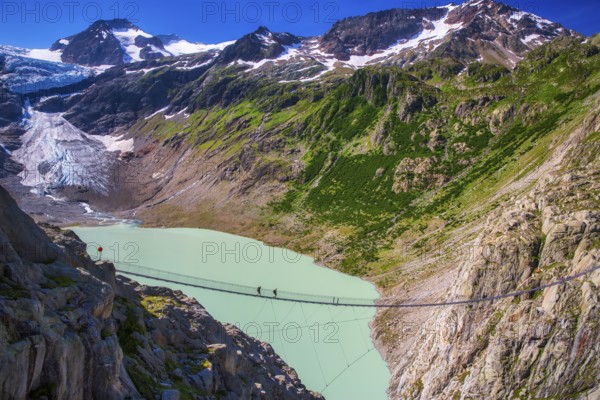 Trift Footbridge, a pedestrian suspension bridge built to replace a hiking path destroyed by glacial retreat, located near the Trift Glacier, Climate Change, Global warming, Gadmen, Canton of Bern, Switzerland